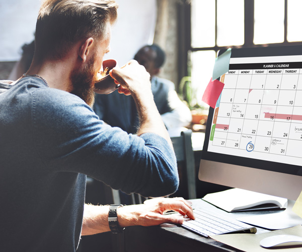 Planning the Stag Do. Man sitting front of the computer. 